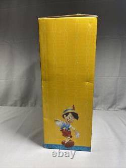 Disney Classics Pinocchio Telco Wind Up Musical Figure Holding Gift
